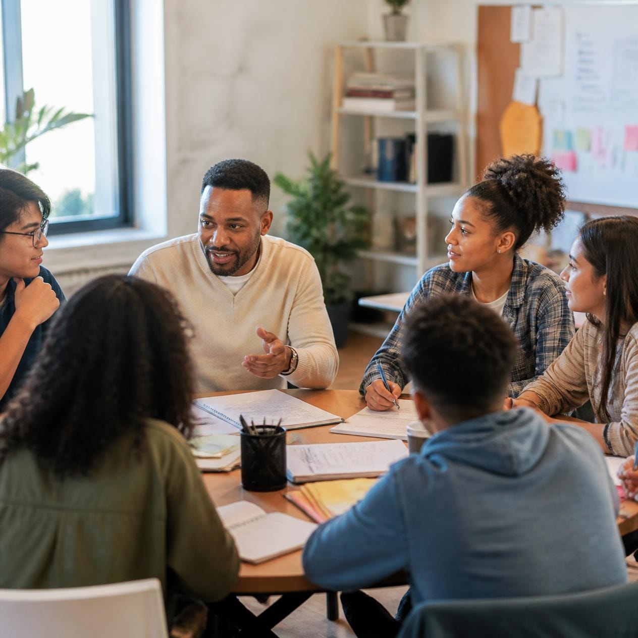 Young adults in a life skills workshop with a mentor